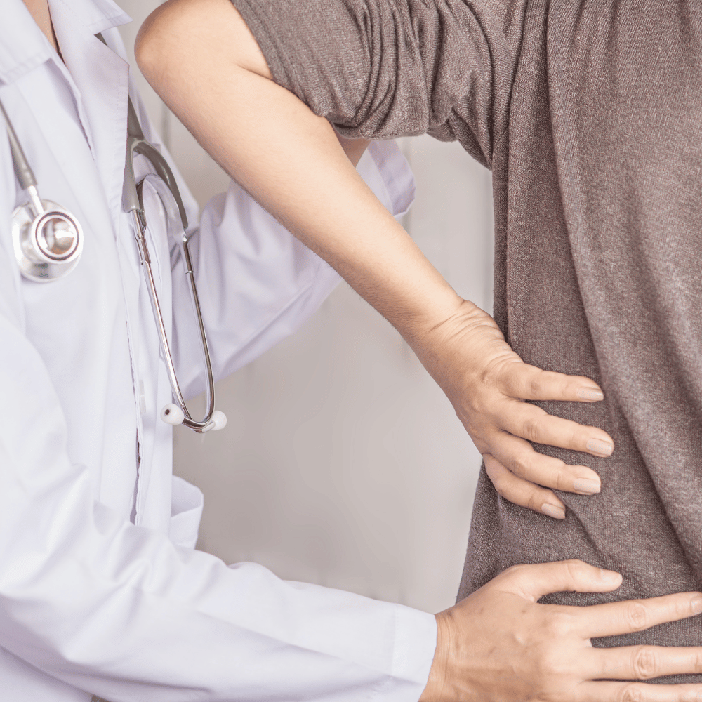 Medical Examination: Doctor Assessing Patient with Back Pain