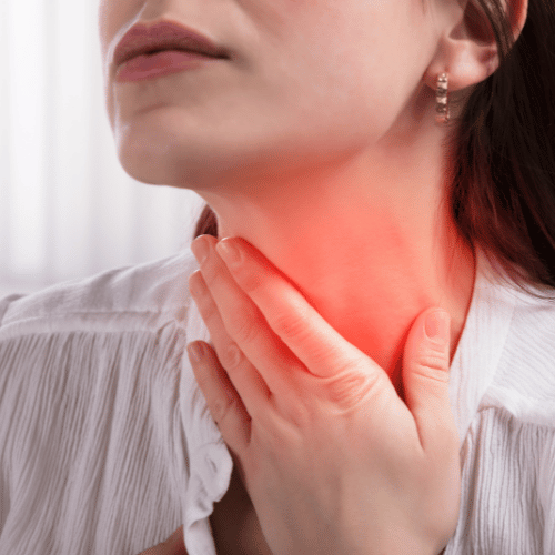 Woman Suffering From Sore Throat