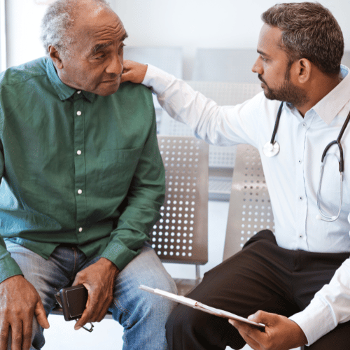 Doctor talking to senior male patient about the results of hormone screen