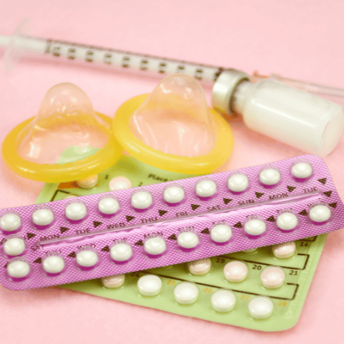 Contraception Education Concept with Oral contraceptive, Injection Contraceptive and Male Condom.