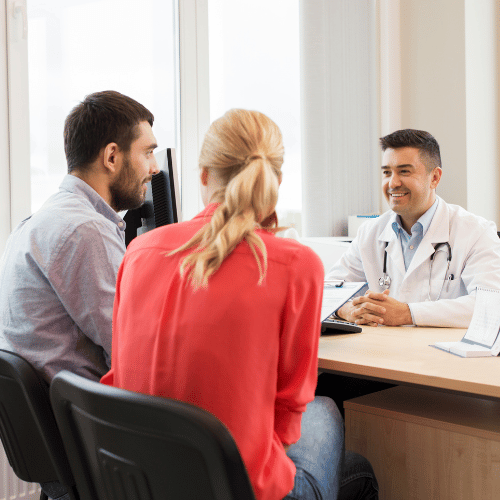 Couple Visiting Doctor at Family Planning Clinic