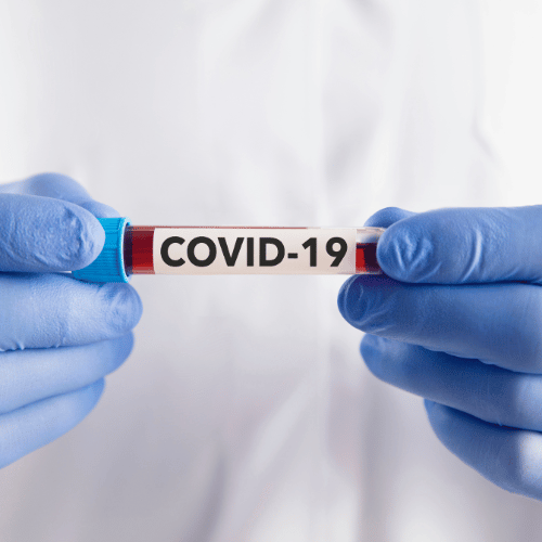 doctor holding blood sample for COVID