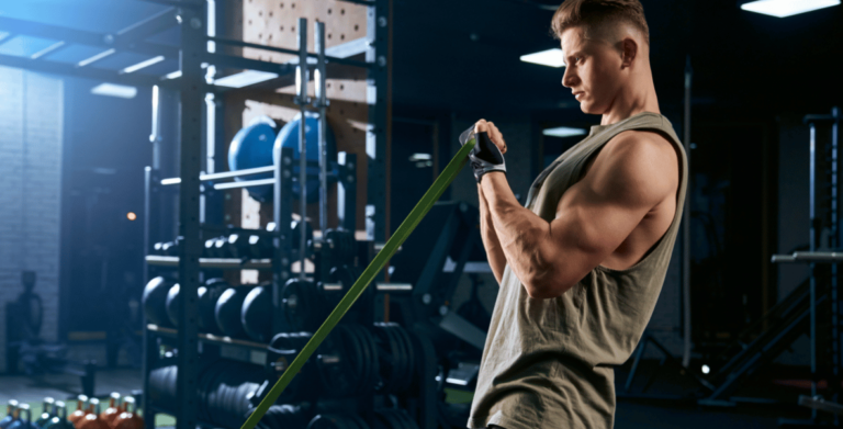 Bodybuilder training arm with resistance band.