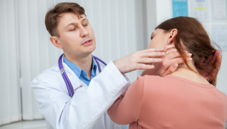 A doctor is checking a woman's neck as part of an evaluation for potential meningitis symptoms.